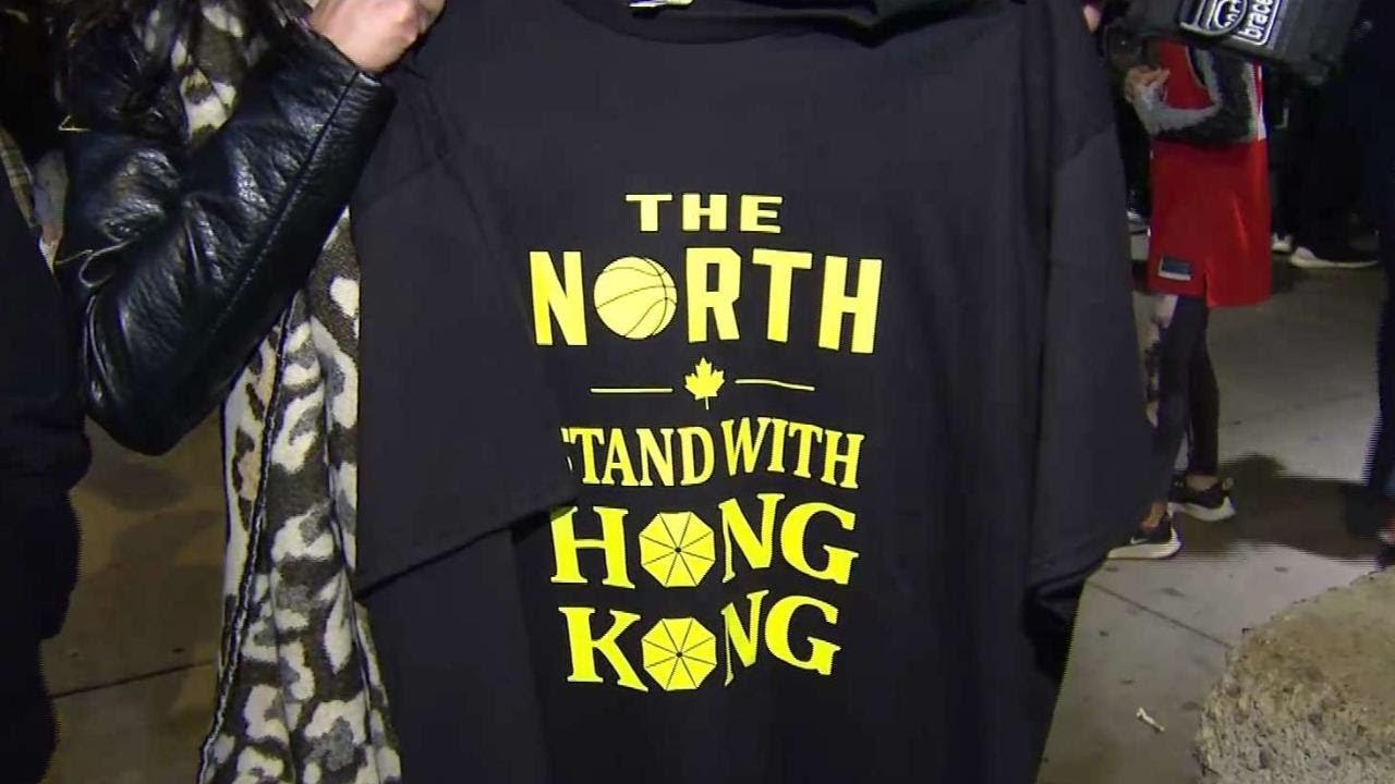 Pro-Hong Kong protesters hand out t-shirts at Raptors game