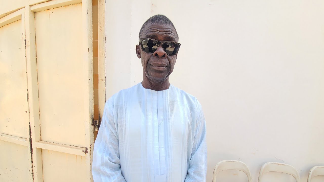 VETERAN JOURNALIST AZIZ WILLAN AT THE FUNERAL SERVICE OF VETERAN BROADCASTER MALICK JONES