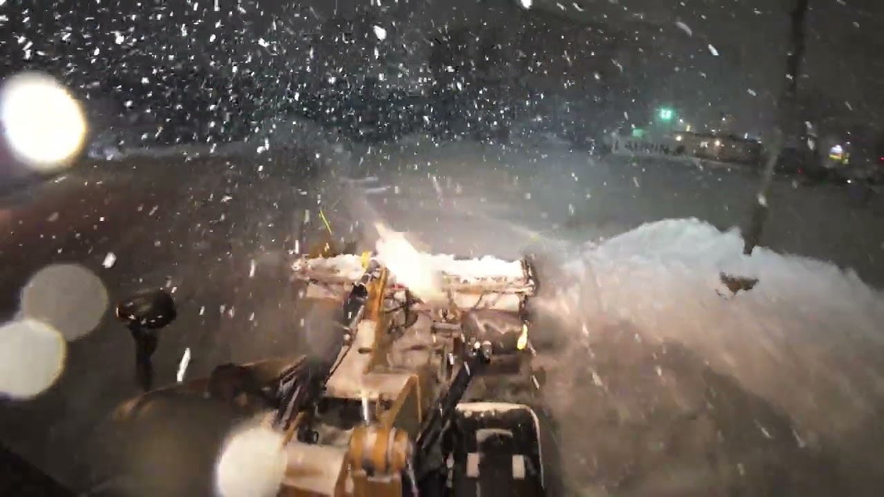Snow plowing with a cat 908 and a metalpless blade