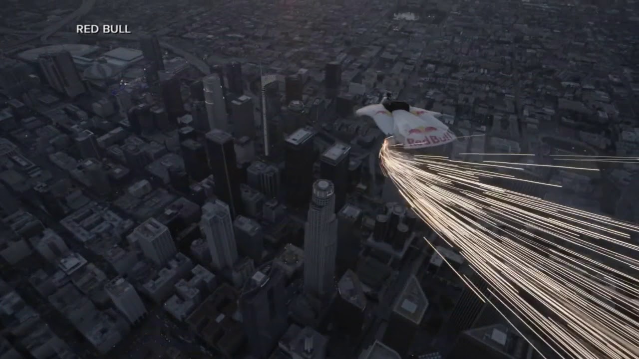 RAW VIDEO: Winged jumper with pyrotechnics soars across DTLA