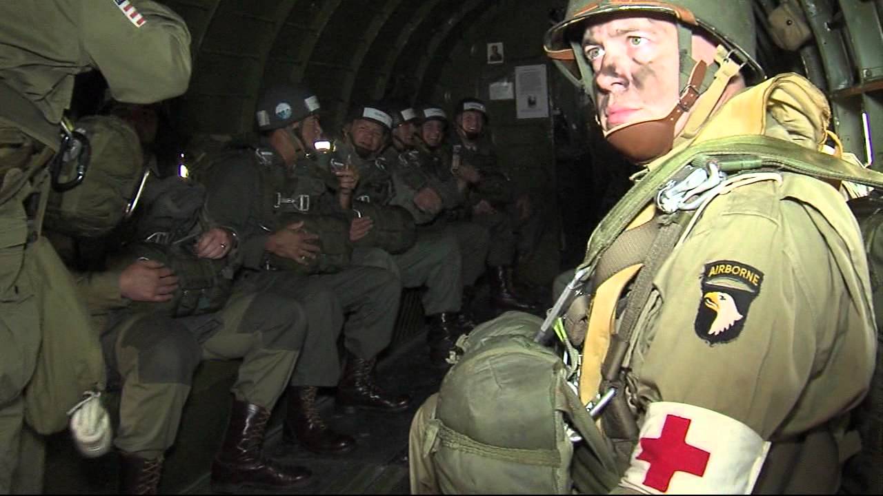 Civilians and veterans graduate from a World War 2 style jump school