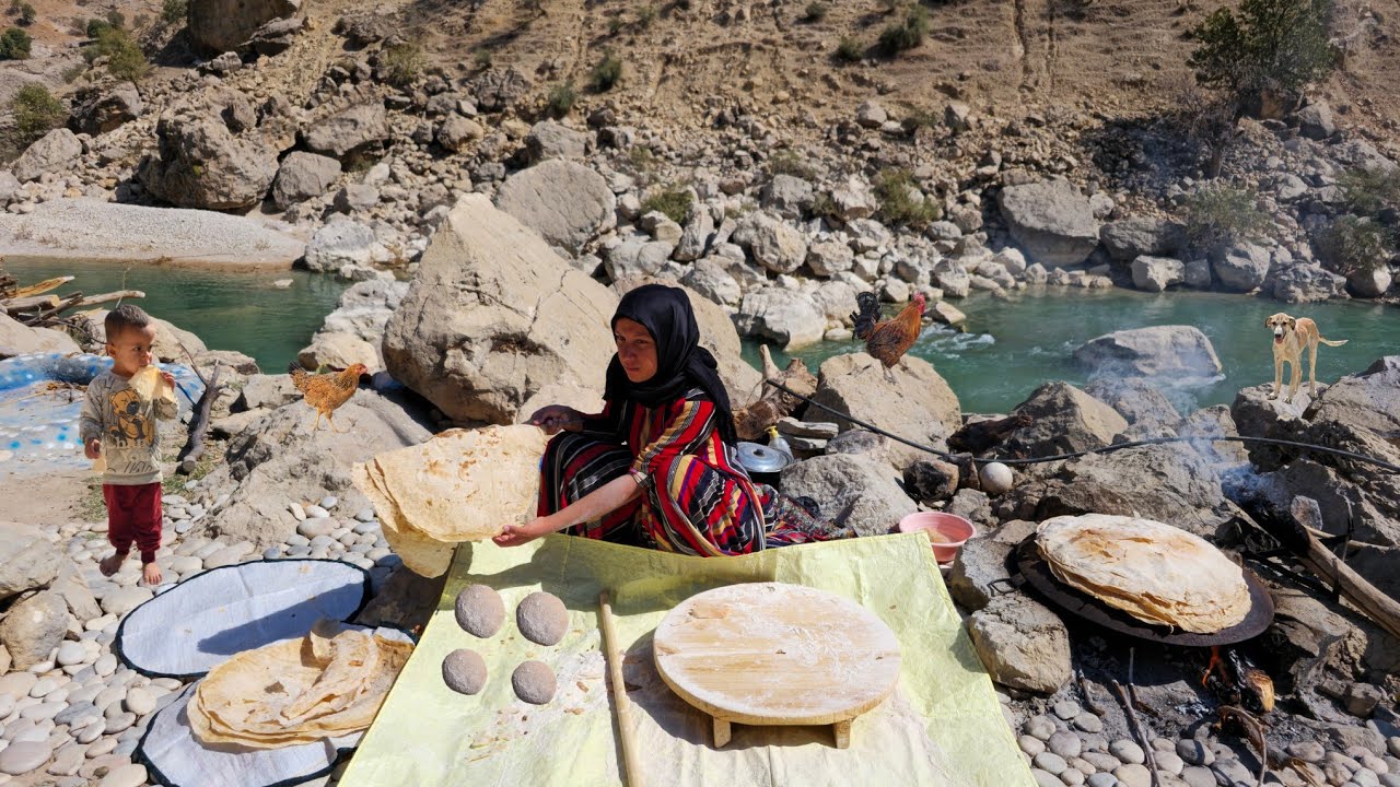 A single woman's life by the wild river: baking local bread over a fire in the Zagros Mountains