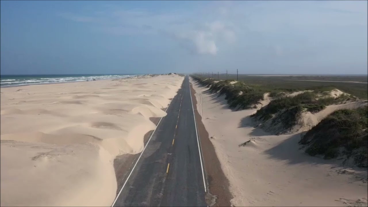 Sand dunes drifting onto Hwy100 South Padre Island Texas