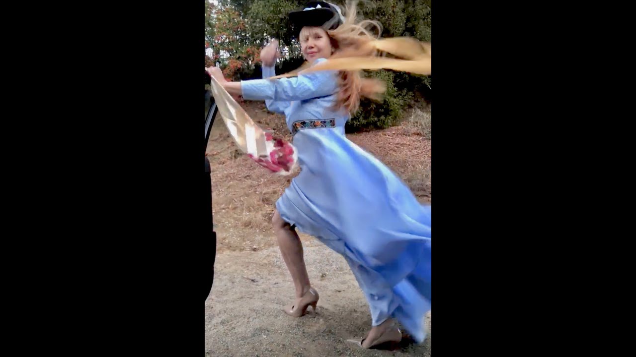 super windy day with blue satin dress