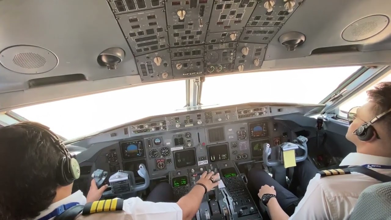 FOKKER F100 APPROACH AND LANDING ON RUNWAY 29R OF KERMANSHAH AIRPORT AT DAY.(OICC/KSH).