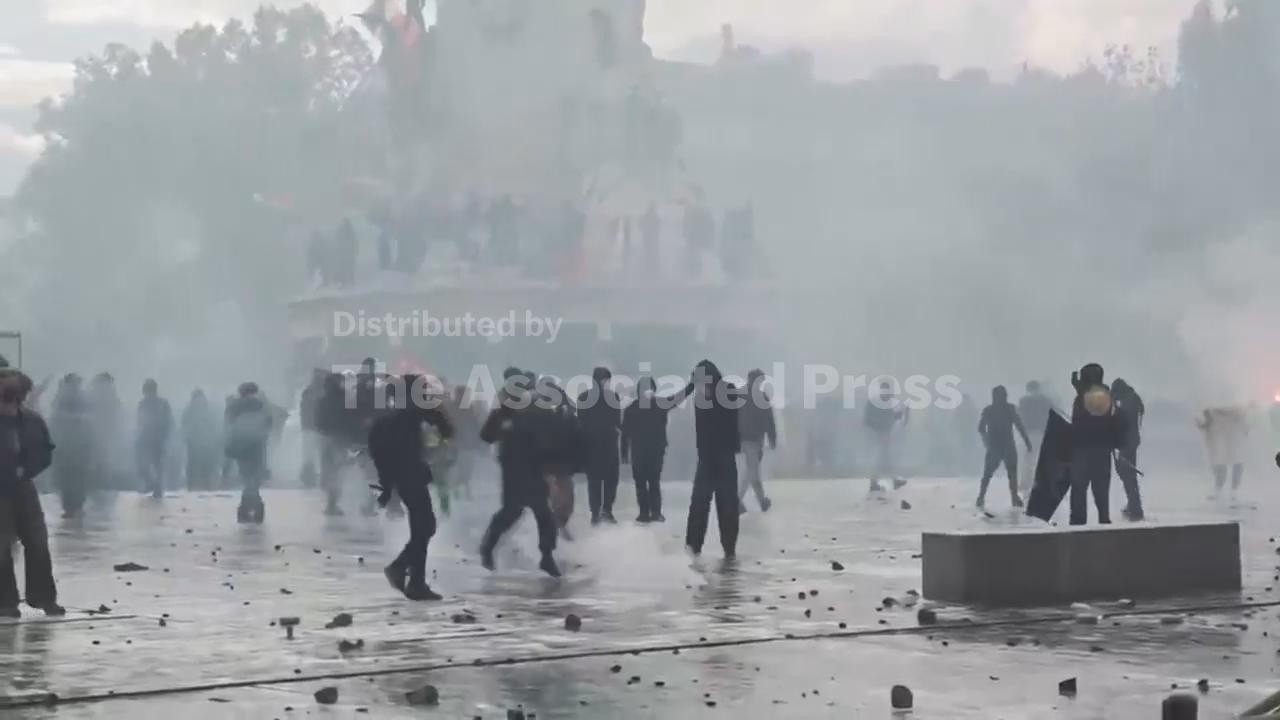 Paris police use tear gas and water cannons to disperse protesters