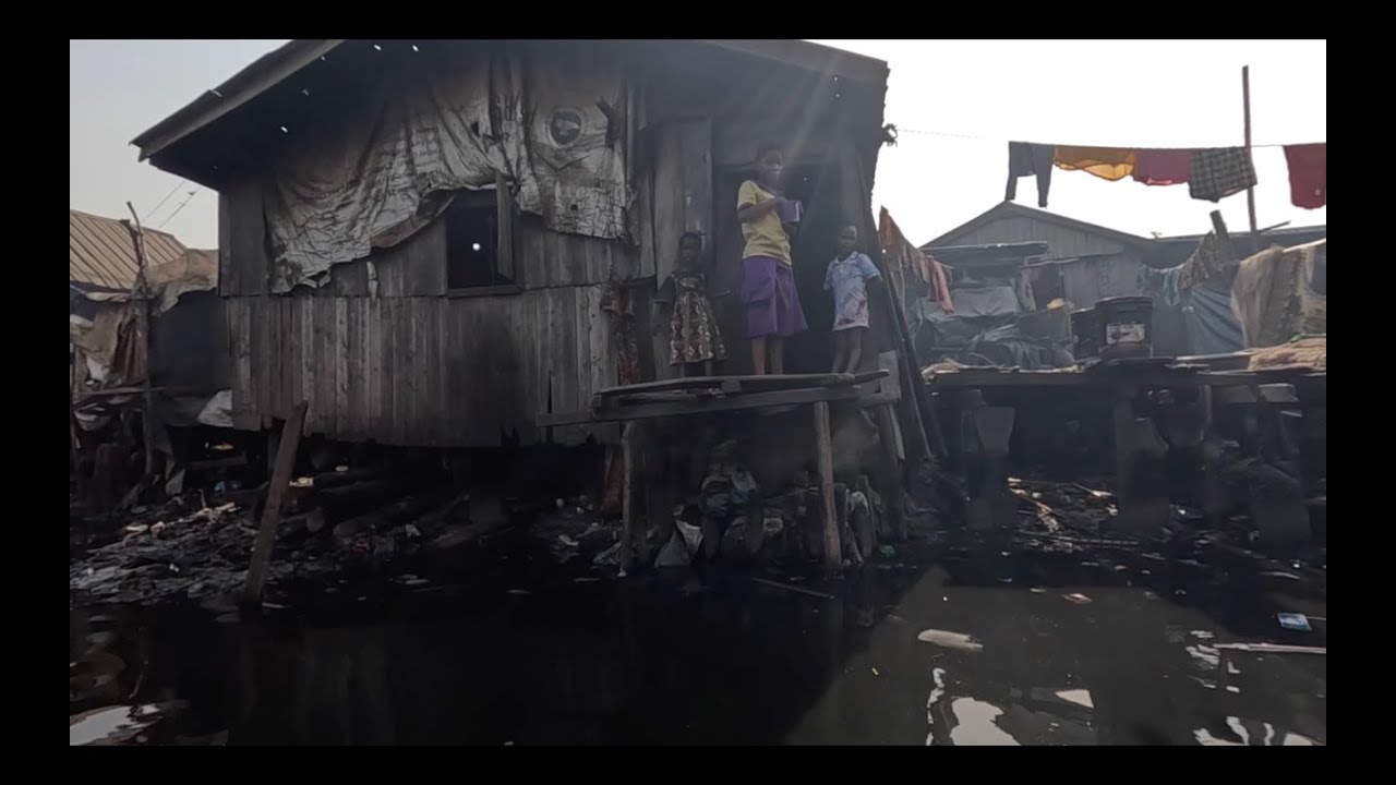 CAUSING CHAOS AND MAYHEM GIVING MONEY AWAY IN NIGERIA'S BIGGEST FLOATING SLUM MAKOKO PART 1