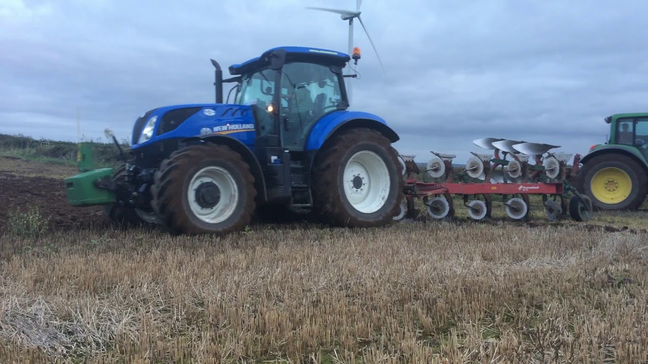 Whyte Agri -ploughing under windmills