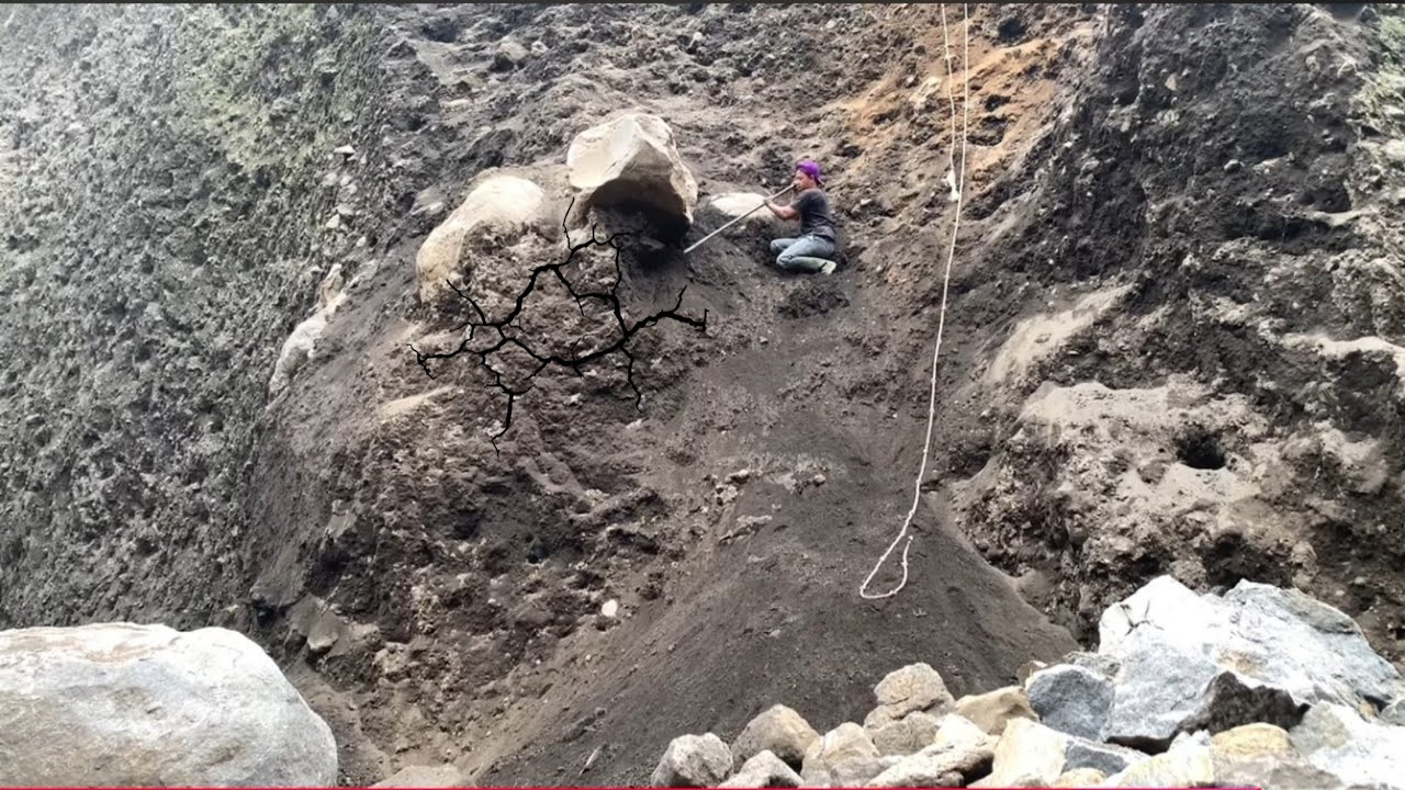 This miner's action is so crazy, he drops big rocks until they shake