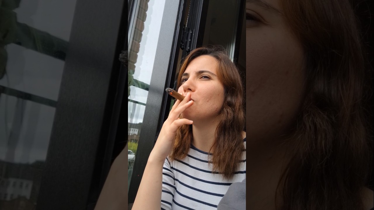 My woman smoking a cigar