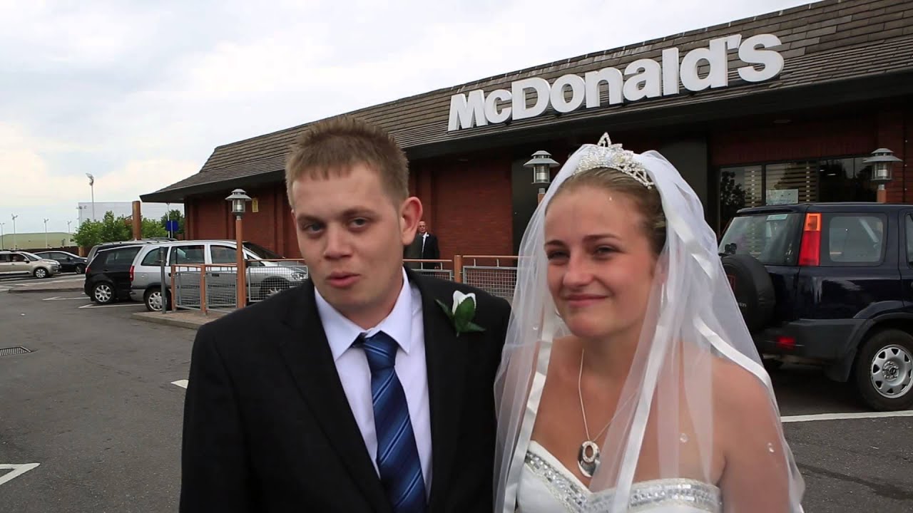 Newly married couple enjoy wedding recepetion in McDonald's
