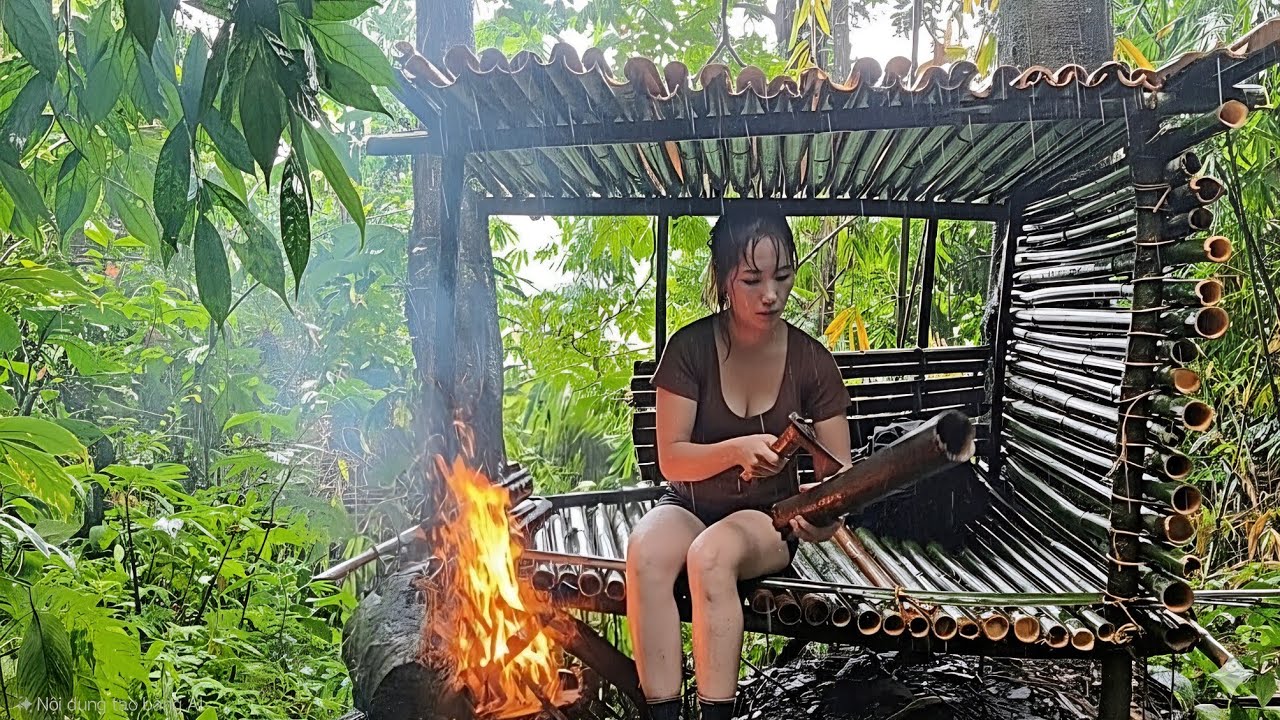 Girl Builds Bamboo Shelter & Makes Fire in Heavy Rain