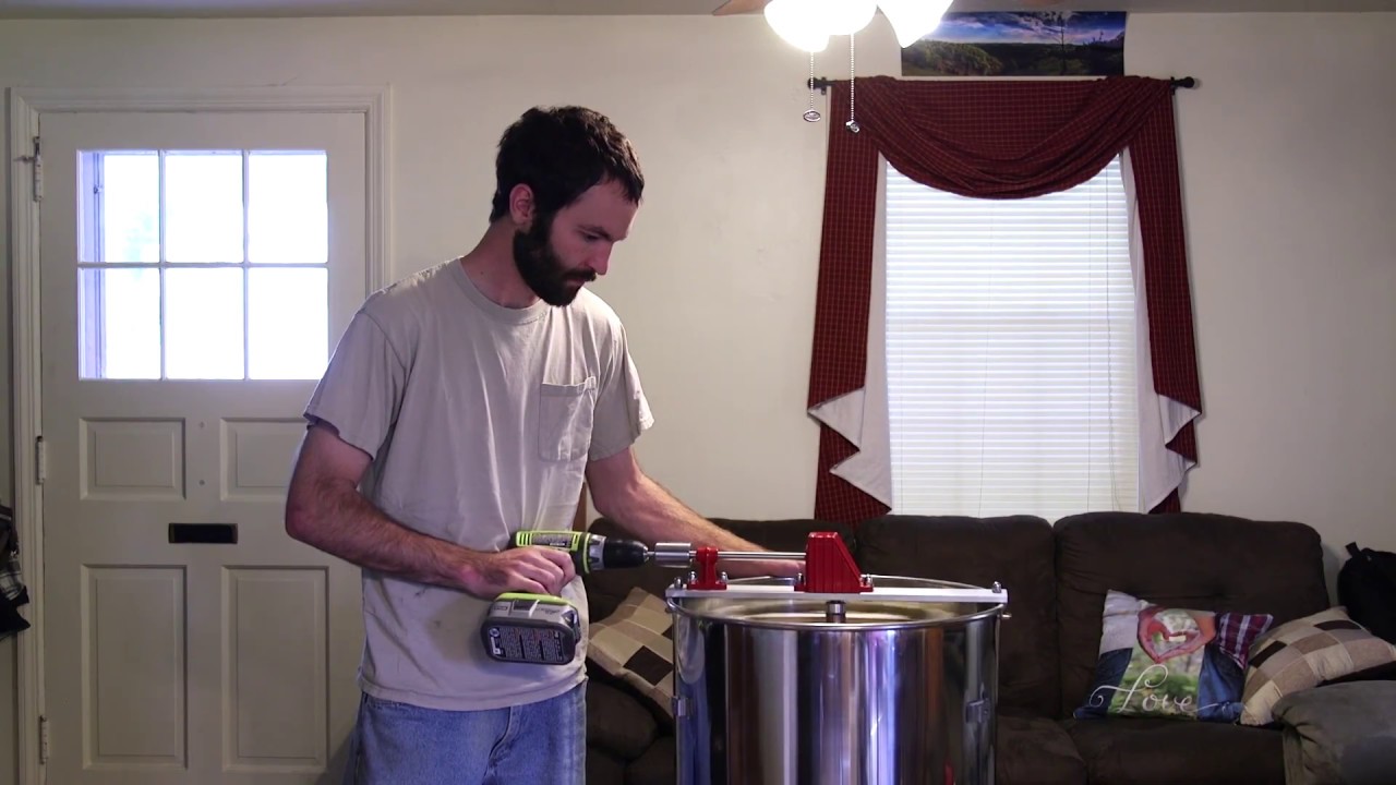 Collecting honey with drill powered honey extractor!