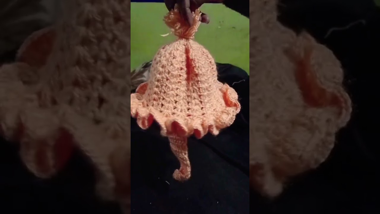 hand made woolen cap for baby in peach color 