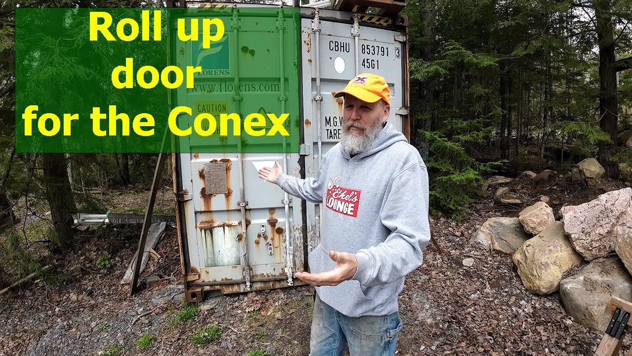 Installing a Roll up door on our shipping container | Fighting Black Flies