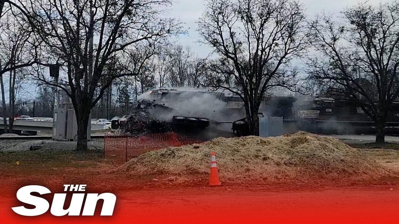 Train derails after crashing into truck carrying massive concrete beam