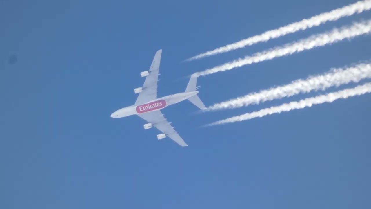 A nice cruising Emirates Airbus A380-861 trailing overhead in clear skies at 33,000 ft