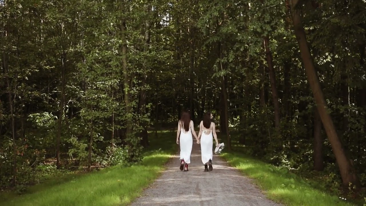 couple holding hands while walking