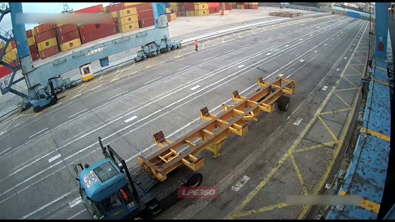 Freight containers fall on a truck in port