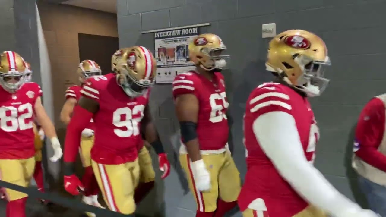 49ers locker room door opens to the Kodak Black boom box — Deebo Samuel and Trent Williams lead