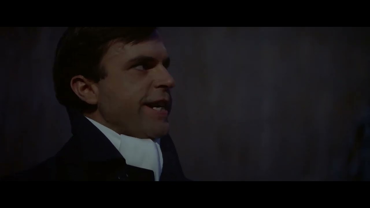 Sam Neill as the Antichrist (or similar) preaches to a crowd in 