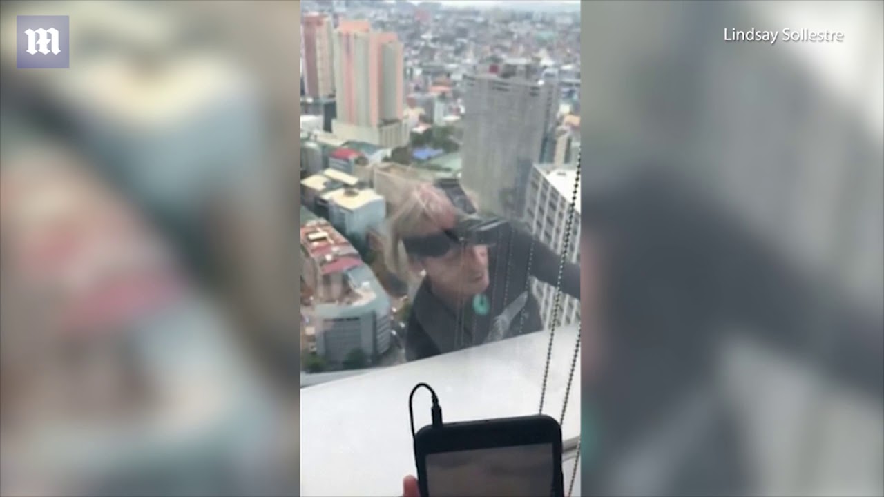 French 'Spiderman' Alain Robert scales 47-storey tower in Manila