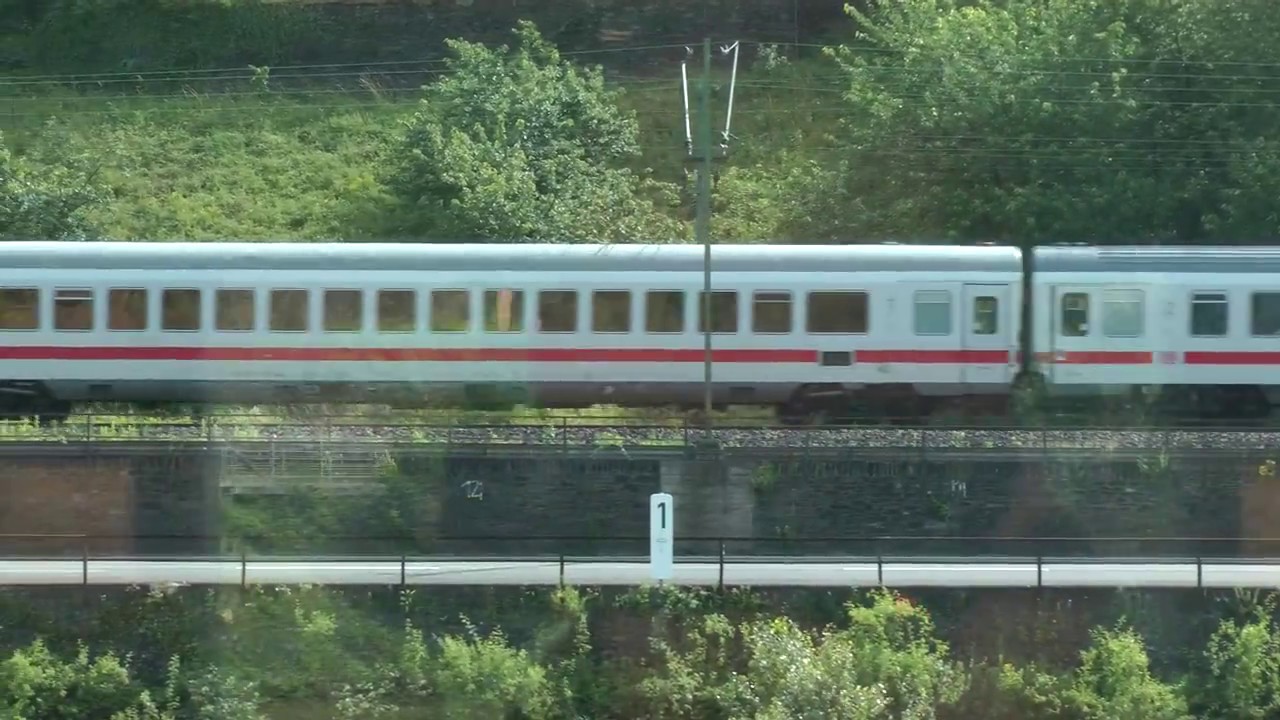 German passenger train near famous Lorelei statue along the Rhine River in Germany
