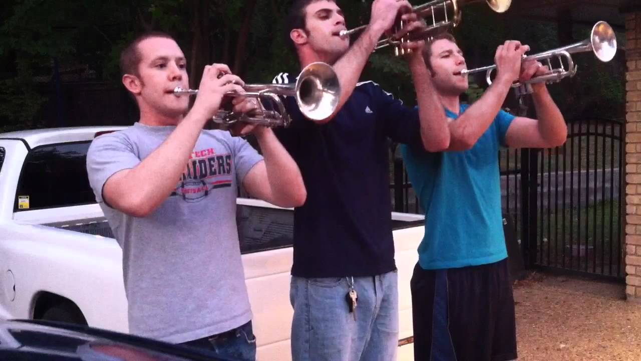Trumpet trio plays national anthem