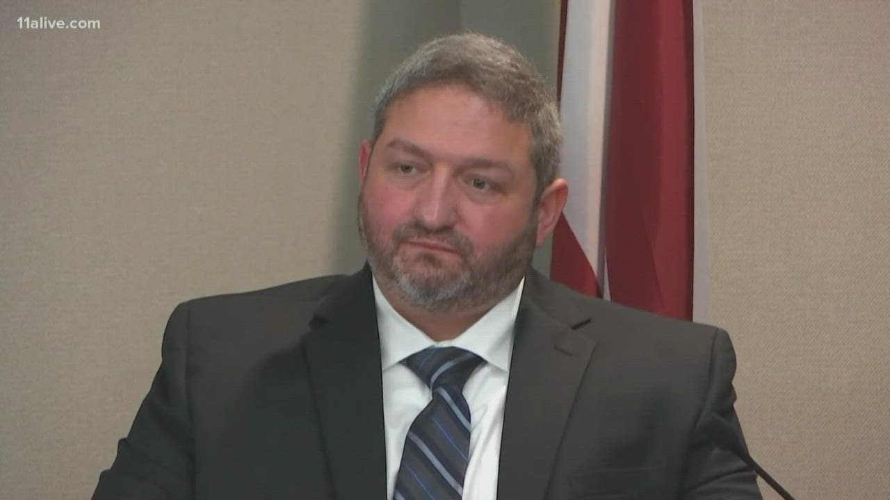 Ahmaud Arbery death trial | Officer: Greg McMichael said 'I don't know' if Arbery committed crime