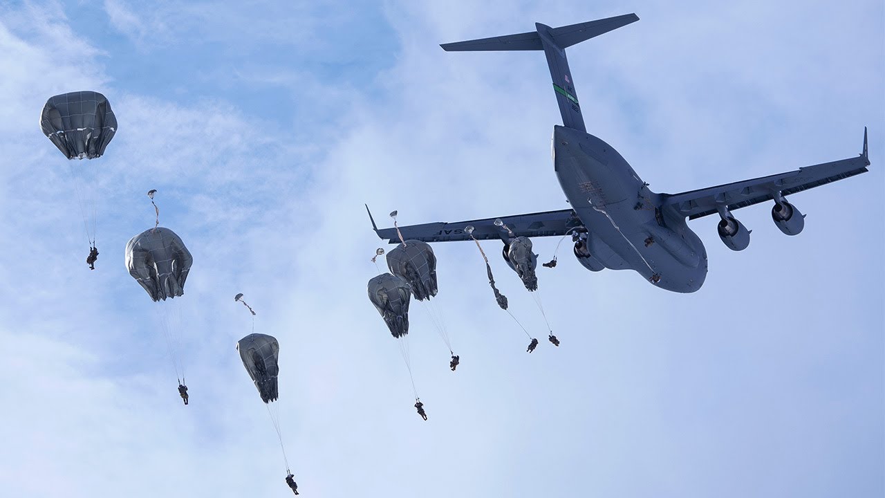 US Army Paratroopers Jump from a C-17 Globemaster III Aircraft 
