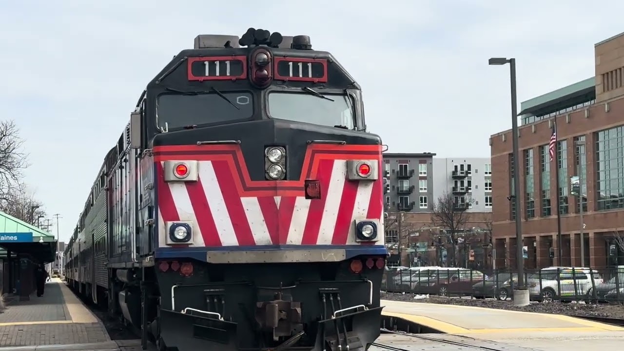 Metra 111 trails an inbound Metra train