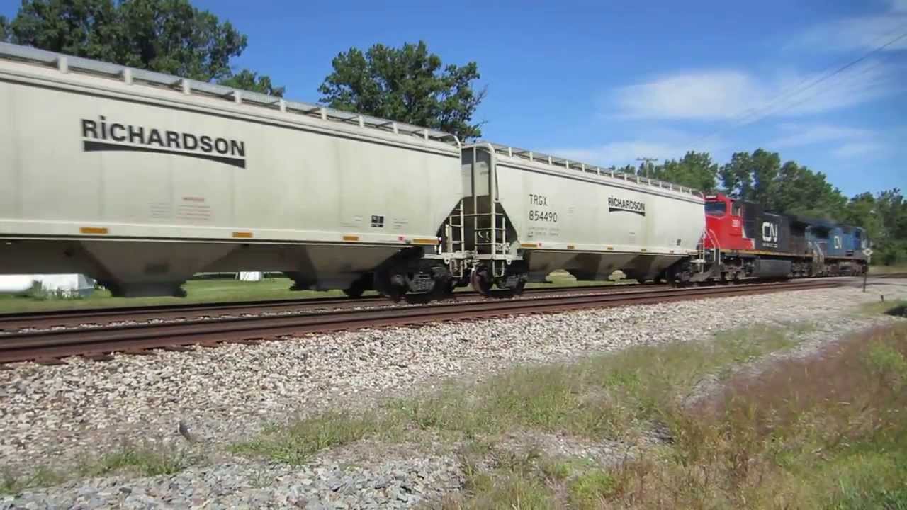 I.C. 2462, CN 2681 pulling Kasgro Rail depressed-center flat car at Vicksburg, MI