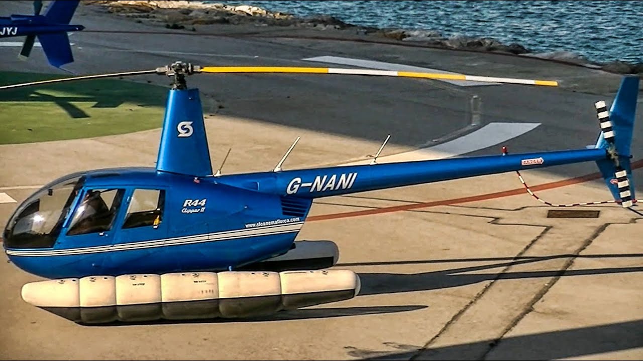 Robinson R44 Clipper G-NANI helicopter on floats departing from Barcelona heliport