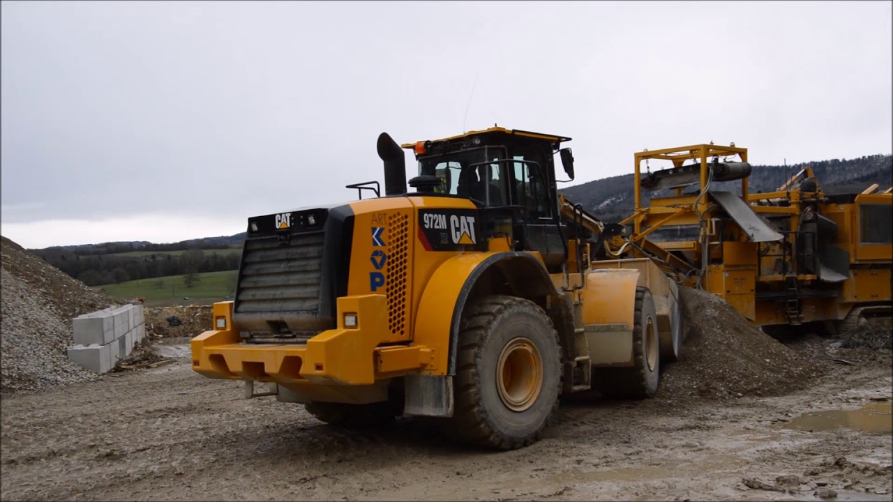 Création de rampe sur stock de 0/60 avec Cat 972M XE - Art Kopp AG.