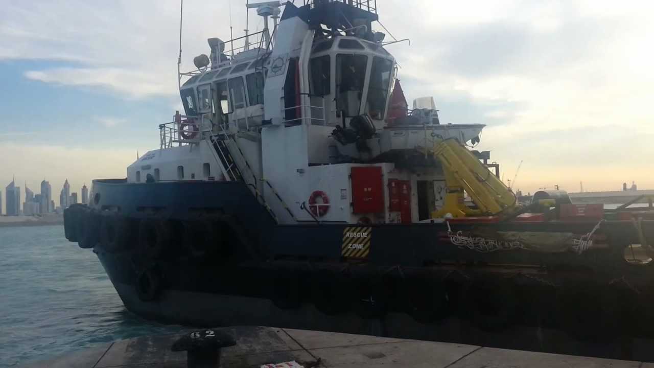 Supply Boat Berthing in Port Rashid with Beautiful Dubai in the Background.mp4