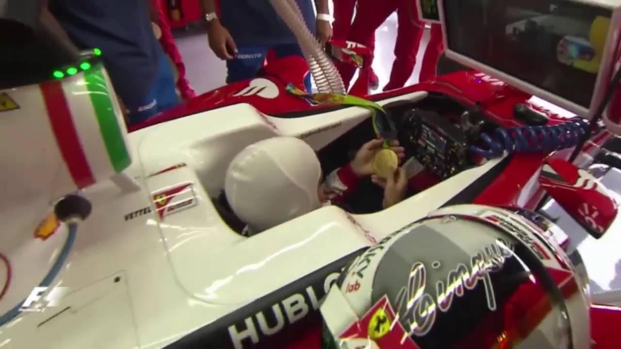 F1 2016 Italian GP - Sebastian Vettel checking out Fabio Basile's Olympic gold medal