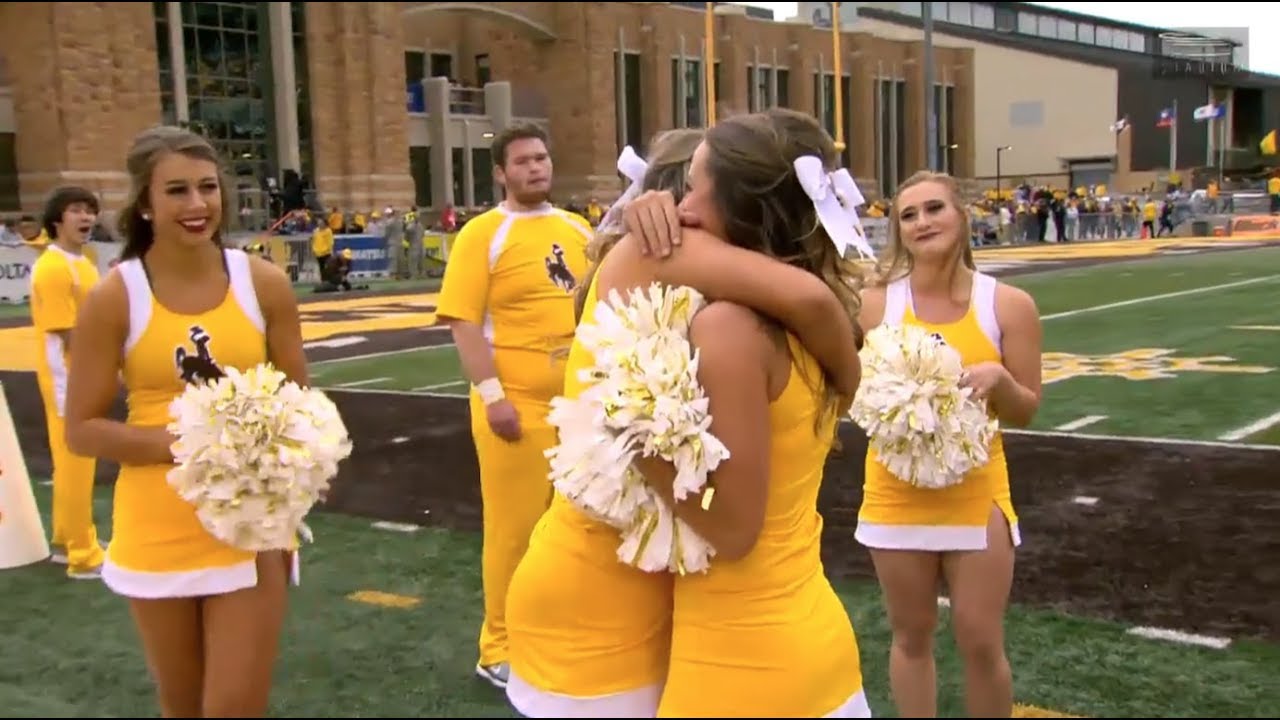 Wyoming Cheerleader Gets Big Surprise During Football Broadcast