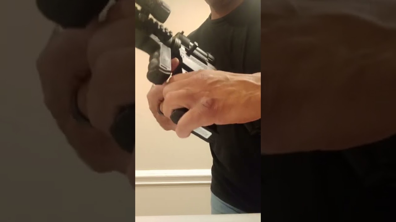 Locking back the bolt on the Mossberg International 715p