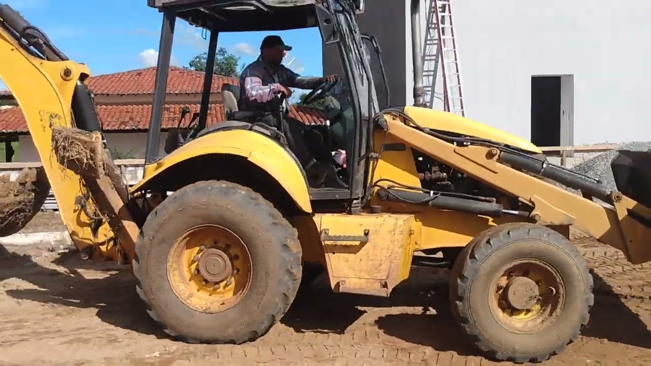 Retroescavadeira new Holland carregando caminhão!