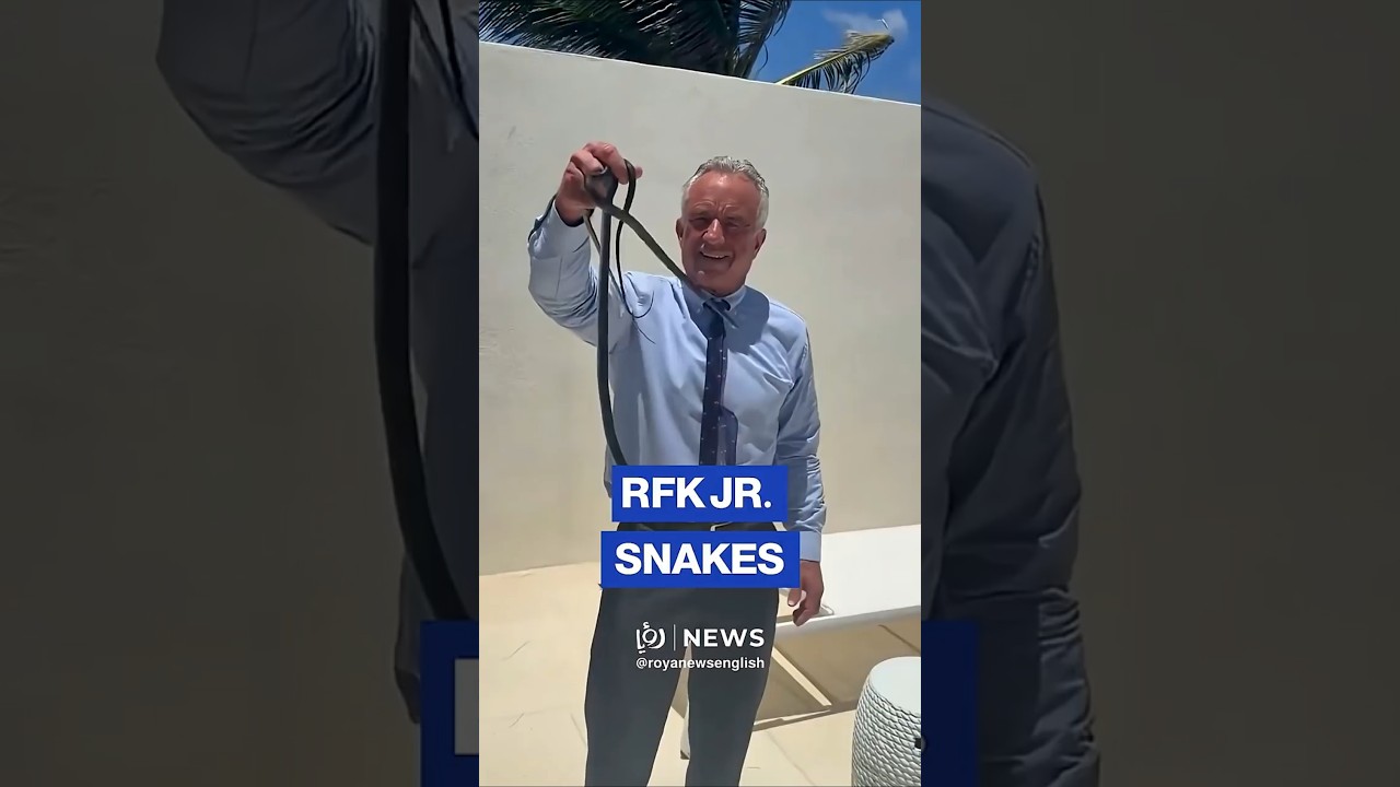 US Health Secretary RFK Jr. wrangling two snakes