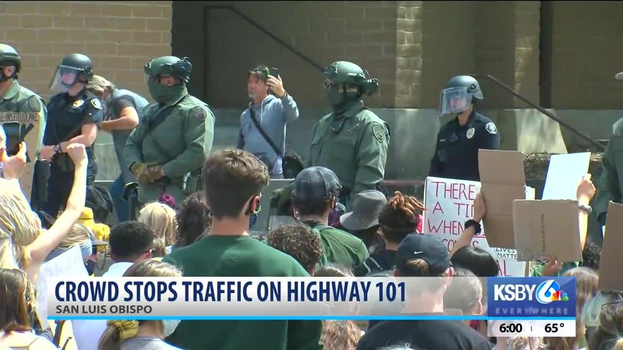Officers kneel with protesters in SLO; crowd blocks Hwy 101