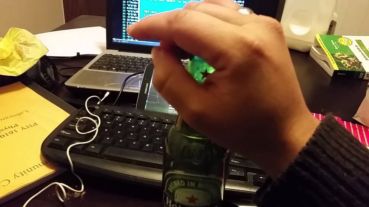 Open beer bottle with a ring