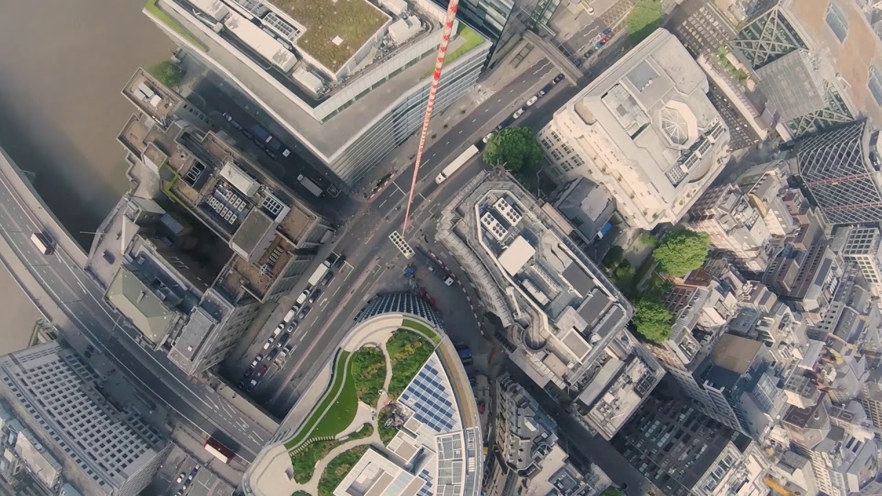 Helicopter lifting a chiller through London
