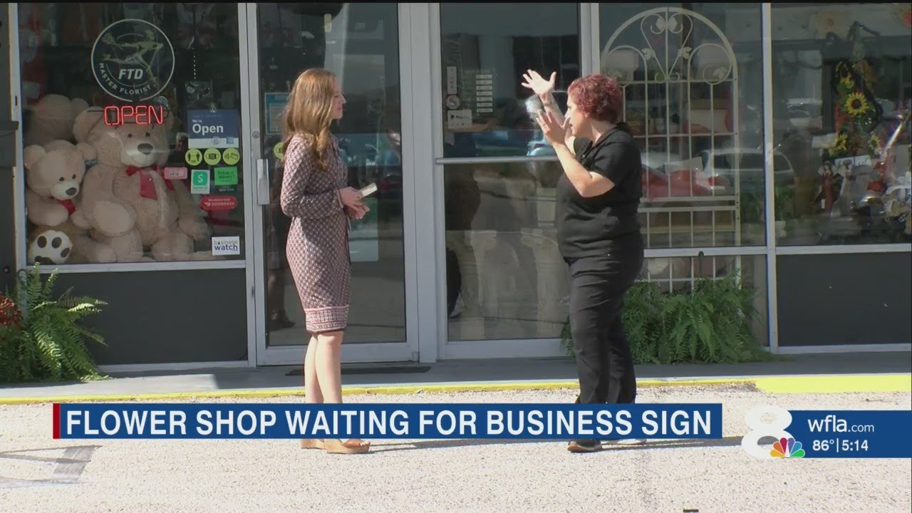 Tampa flower shop owner wants sign she paid for