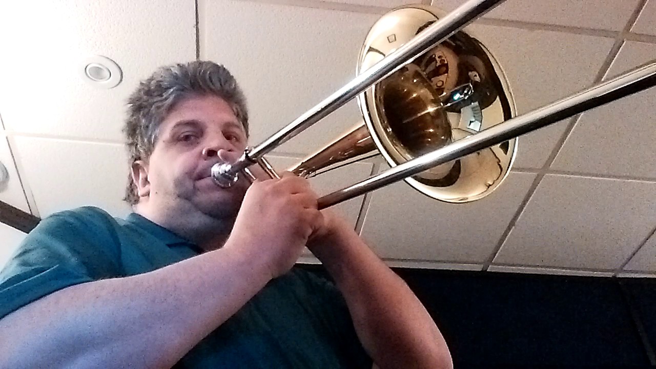 Demonstrating Tenor Trombone; Tenor with F attachment; and Bass Trombone