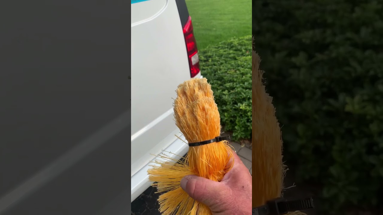 Removing spider webs on a stucco house-de webbing