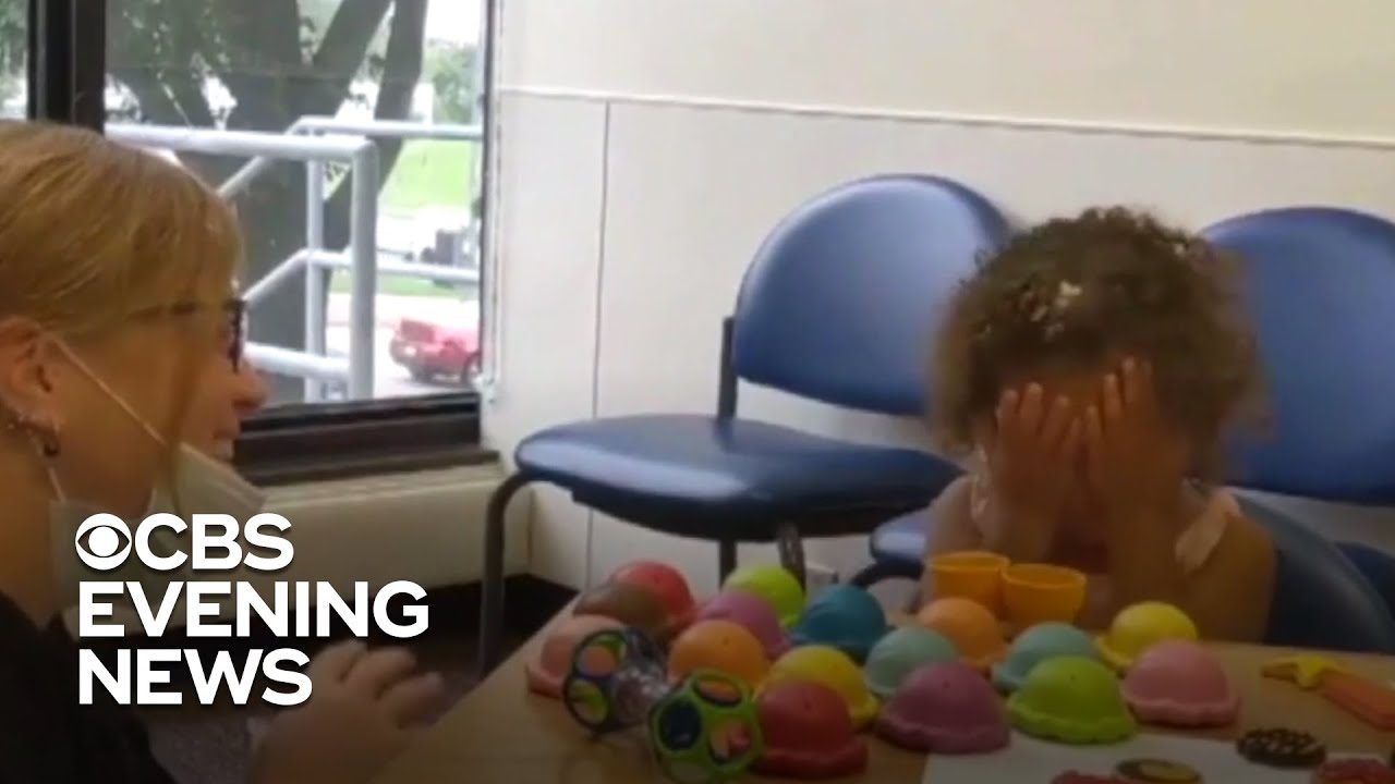 Two-year-old hears for the first time after cochlear implants