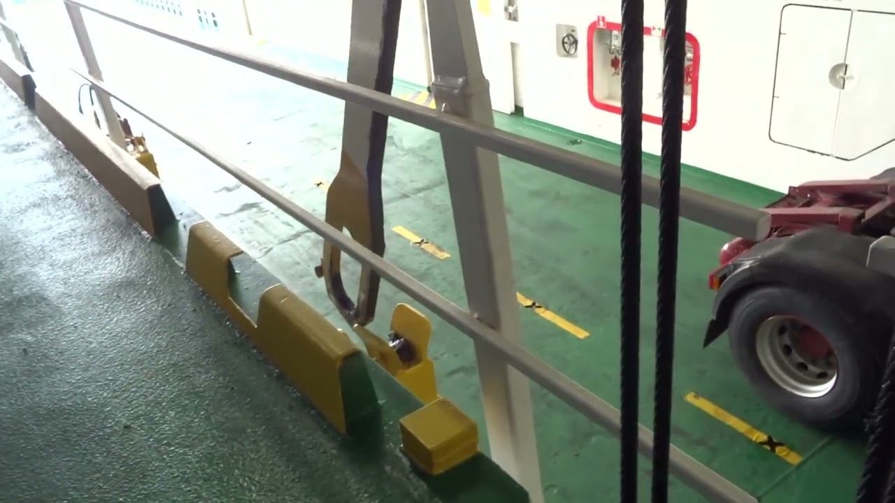 Raising the mezzanine car deck on Calmac ferry Finlaggan leaving Islay Argyll Scotland on 8.8.23