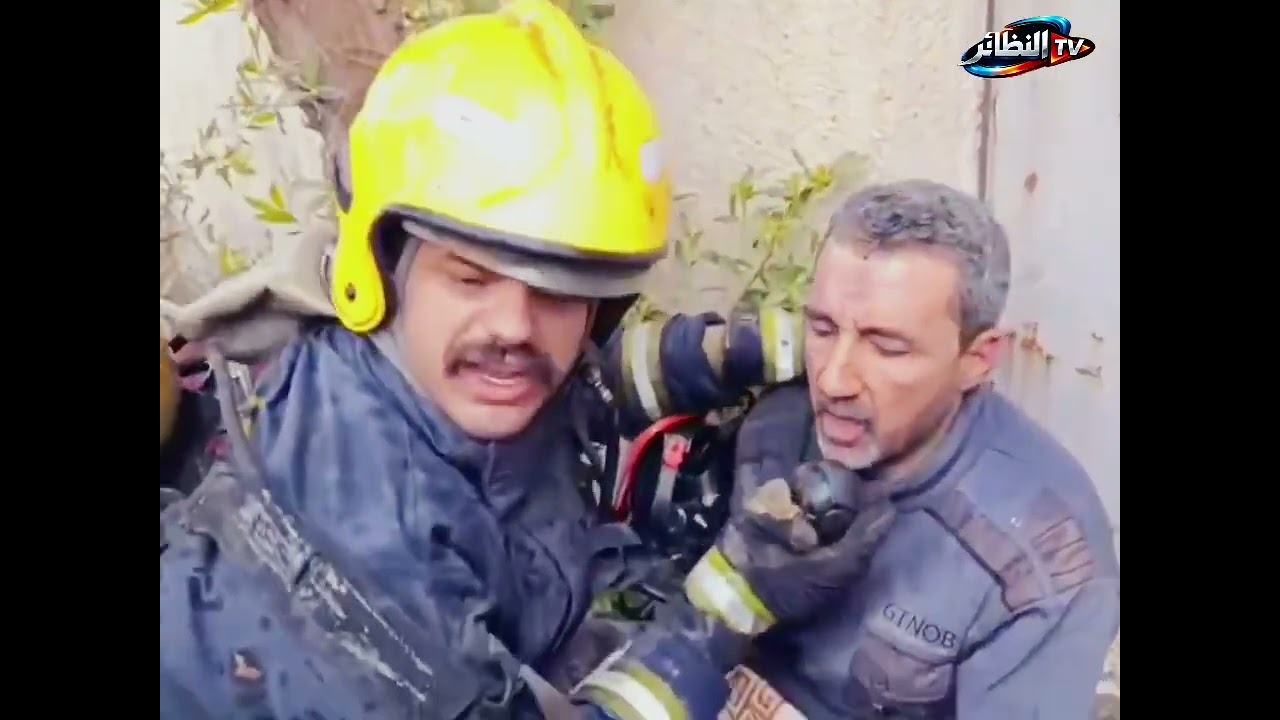 انقاذ عائلة متكونة من 4  افراد محاصرين من قبل ابطال الدفاع المدني ببغداد بعد احتراق المنزل والسيارة 