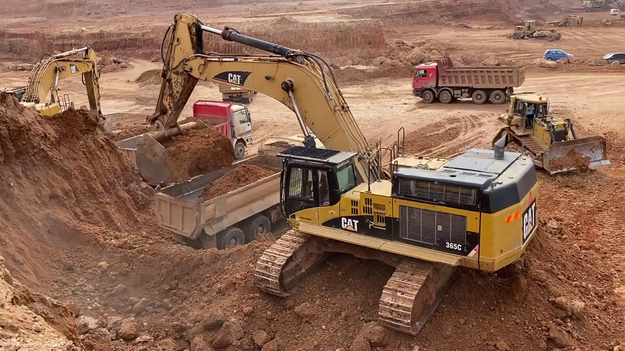 Caterpillar Machines Everywhere - Caterpillar 365C Excavator Loading Trucks